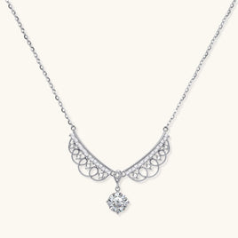 Delicate sterling silver necklace with intricate angel wing pendant featuring brilliant moissanite stones in openwork design