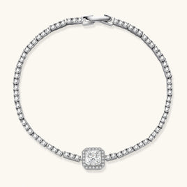 Sterling silver tennis bracelet with cushion-cut moissanite centerpiece surrounded by smaller stones in continuous setting