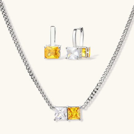 Matching necklace and drop hoop earrings with golden yellow and clear square zirconia stones | Olaty