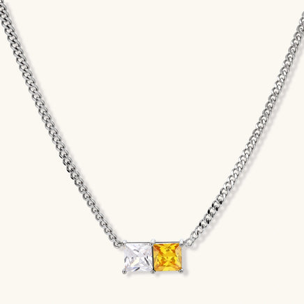 Curb chain necklace with clear and golden yellow square zirconia pendant | Olaty