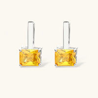 Pair of drop hoop earrings with golden yellow square zirconia stones | Olaty