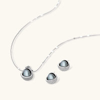 Dark sphere pendant necklace and matching stud earrings with clear zirconia details | Olaty