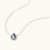 Dark sphere pendant necklace with clear zirconia encrusted setting | Olaty
