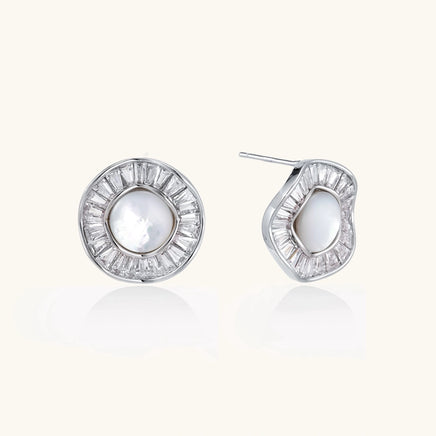 Radiant Pearl Halo statement stud earrings with freshwater pearl centers and geometric crystal halos angled view | Olaty
