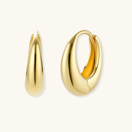 Golden Era Huggie Hoops in polished 14K gold-plated sterling silver shown from front and side | Olaty