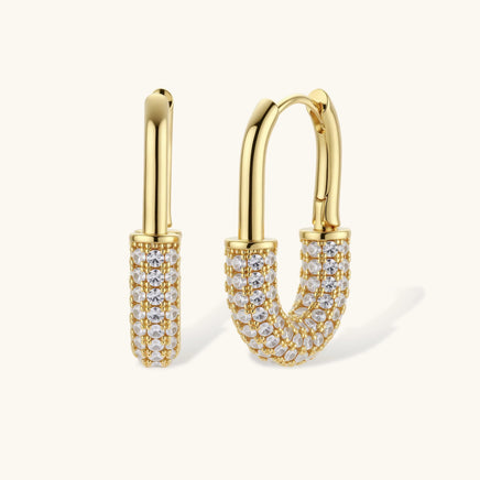 Golden Glow zirconia huggie hoop earrings in 14K gold-plated eco-brass shown in front and side view | Olaty