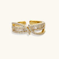 Infinity Twist gold ring featuring layered zirconia bands and sculptural infinity-inspired crossover design | Olaty