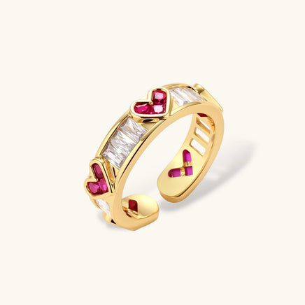 Love + Logic adjustable gold ring with red heart and clear baguette zirconia angled view | Olaty