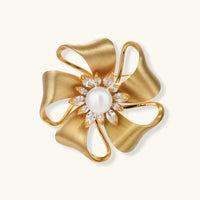 Golden Bow Blossom pearl statement brooch with sculptural bow petals and zirconia accents front view | Olaty