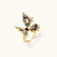 Iridescent butterfly statement ring with organic shell inlays and sculptural gold-tone frame | Olaty