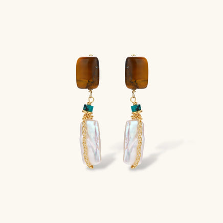 Front view of amber baroque pearl drop earrings with turquoise accents and gold chain details | Olaty