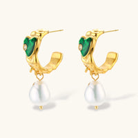 Side view of sculptural gold heart hoop earrings with green enamel details and pearl drops | Olaty