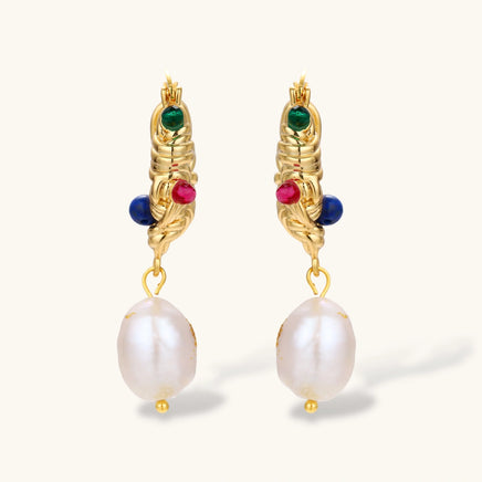 Front view of gold sculptural hoop earrings with colorful gems and baroque freshwater pearls | Olaty