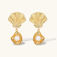 Front view of gold shell drop earrings with round freshwater pearls and textured oyster pendants | Olaty