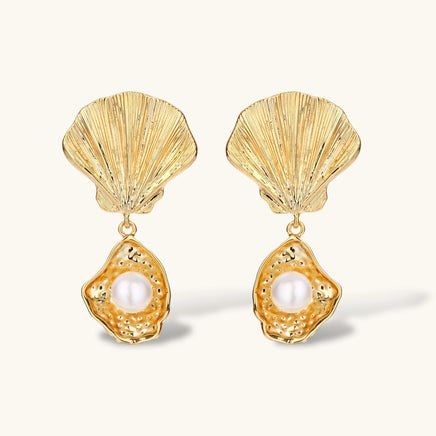 Front view of gold shell drop earrings with round freshwater pearls and textured oyster pendants | Olaty