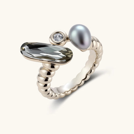 Adjustable copper-plated coffee gold ring with twisted band featuring elongated crystal, round zirconia, and grey pearl.