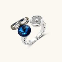 Cosmic Trio statement ring with blue faceted stone, elongated crystal and sparkling flower detail | Olaty