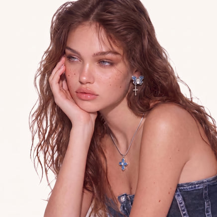 Denim Cross Pendant Necklace worn with a silver-tone chain, featuring blue denim panels and central zirconia | Olaty