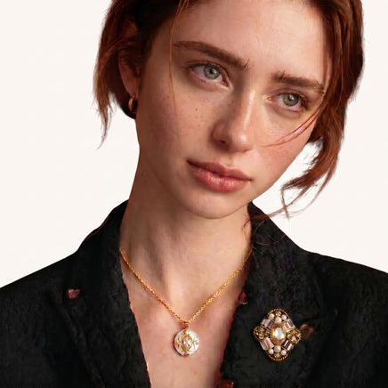 Baroque Crown Crystal Brooch styled on a black blazer with ornate mixed-tone crystals and pearl accents | Olaty