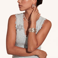 Winter Crystal Snowflake Statement Brooch styled on a light knit top with sparkling clear zirconia details | Olaty