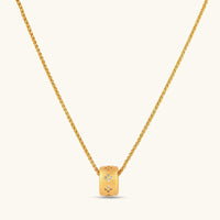 Stardust gold necklace with brushed sliding ring pendant and scattered sparkling crystal accents | Olaty