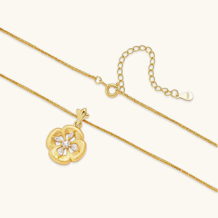 Bloom floral medallion necklace showing gold chain, adjustable extender and cubic zirconia petal pendant | Olaty