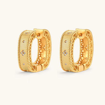 Angled view of baroque square huggie hoop earrings with textured panels and rope-twist edging | Olaty