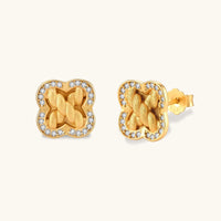 Braided clover halo stud earrings with brushed gold texture and cubic zirconia border in front and angled views | Olaty