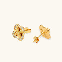 Front and back view of braided clover halo stud earrings showing cubic zirconia accents, posts and butterfly backs | Olaty