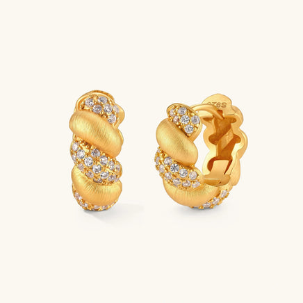 Braided pavé huggie hoop earrings with brushed gold texture and cubic zirconia accents in front and angled views | Olaty