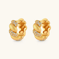 Angled pair of braided pavé huggie hoop earrings with brushed gold texture and sparkling cubic zirconia accents | Olaty