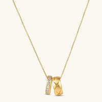 Celestial twin ring gold pendant necklace with star engraving and sparkling cubic zirconia | Olaty
