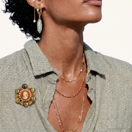 Empress Cameo Brooch styled on a sage green shirt with orange cameo center and green natural stone accents | Olaty