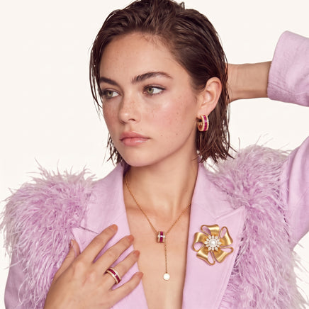 Golden Bow Pearl Blossom Brooch worn on a lilac lapel, featuring a pearl center and sparkling zirconia flower accents | Olaty