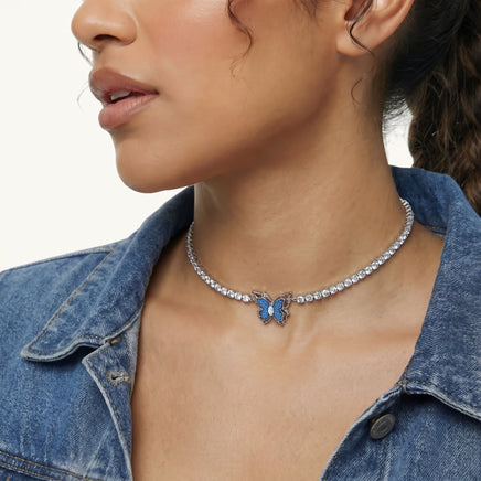 Blue denim fabric butterfly tennis necklace styled with a denim jacket and crystal-set chain | Olaty