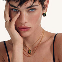 Model wearing Forest Reverie Green Amber Earrings with rectangular green amber stones and gold-plated settings | Olaty