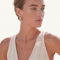 Pearl Cascade Pansy Brooch styled on a white sleeveless top with carved shell flower and cascading pearls | Olaty