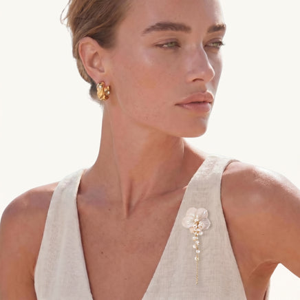 Pearl Cascade Pansy Brooch styled on a white sleeveless top with carved shell flower and cascading pearls | Olaty