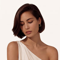 Model wearing Forest Reverie Green Amber Earrings styled with a white one-shoulder top | Olaty