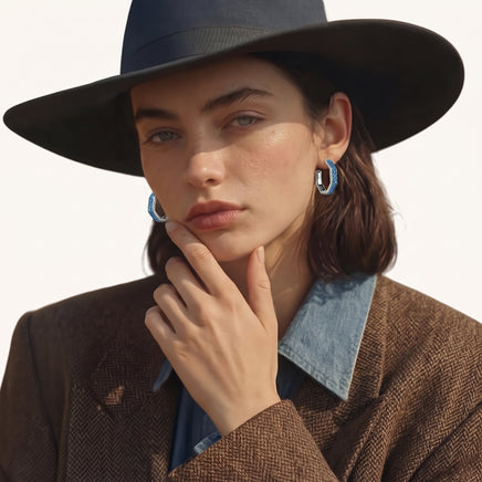Model styling blue denim hoop earrings with a brown blazer and denim shirt | Olaty