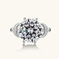 Top view of Promise Bow Statement Ring with large round moissanite center stone and sculptural pavé bow setting | Olaty