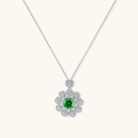 Front view of Green Moissanite Diamond Daisy Bloom Necklace with round green center stone and sparkling floral halo | Olaty