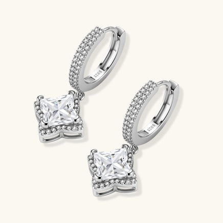 Angled pair of GRA Certified Moissanite Diamond Dangle Huggies with halo-set geometric stones | Olaty