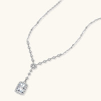 Angled view of GRA Certified Moissanite Diamond Celestial Drop Necklace with halo pendant | Olaty