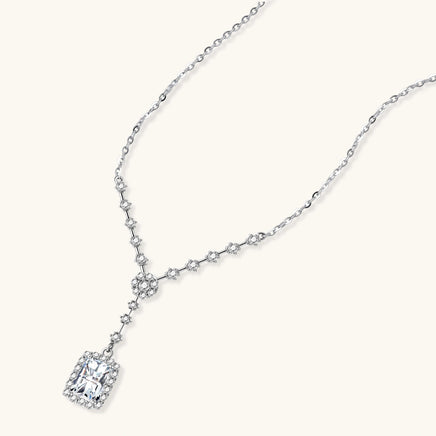Angled view of GRA Certified Moissanite Diamond Celestial Drop Necklace with halo pendant | Olaty