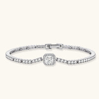 Front angled view of Center Tennis Bracelet highlighting square moissanite centerpiece, halo details and polished sterling silver setting | Olaty