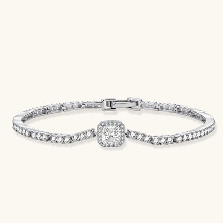 Front angled view of Center Tennis Bracelet highlighting square moissanite centerpiece, halo details and polished sterling silver setting | Olaty