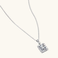 GRA certified moissanite diamond geometric halo pendant necklace in polished 925 sterling silver, angled view | Olaty