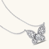 Radiant butterfly moissanite necklace with geometric crystal wings and sterling silver chain angled view | Olaty