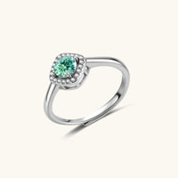 Angled view of GRA Certified Green Moissanite Diamond Emerald Glow Halo Ring with round center stone | Olaty